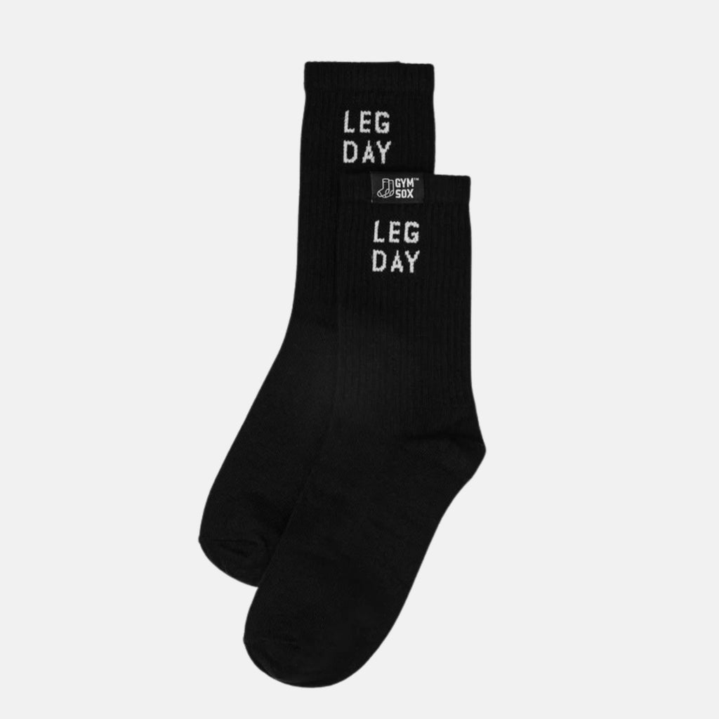 Black socks with 'LEG DAY' text on a light gray background