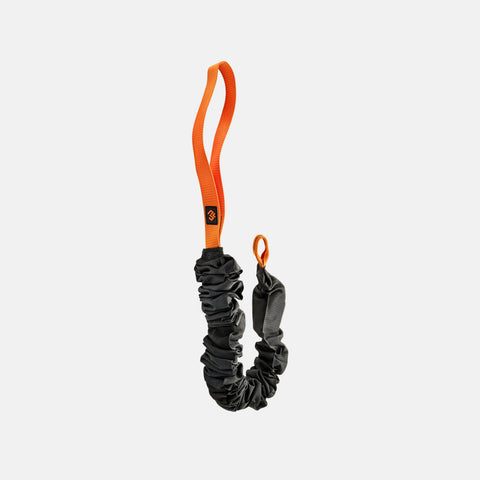 Black resistance band with orange loop on a white background