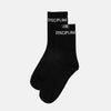 Black socks with 'DISCIPLINE' text on a light gray background