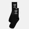 Black socks with 'Habibi Come to Dubai' text on a white background