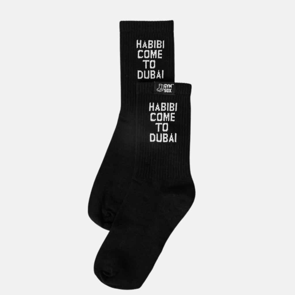 Black socks with 'Habibi Come to Dubai' text on a white background