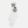 A pair of white crew socks with black text reading 'WEIGHTS BEFORE DATES' and a small black brand tag near the cuff, shown on a light gray background.
