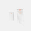 White socks with 'Peach Day' text on a white background