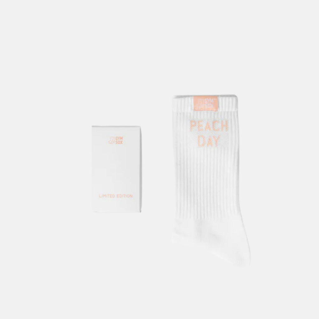 White socks with 'Peach Day' text on a white background