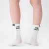 White socks with text worn by a person on a white background