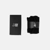 Black gym socks with a branded box on a light gray background