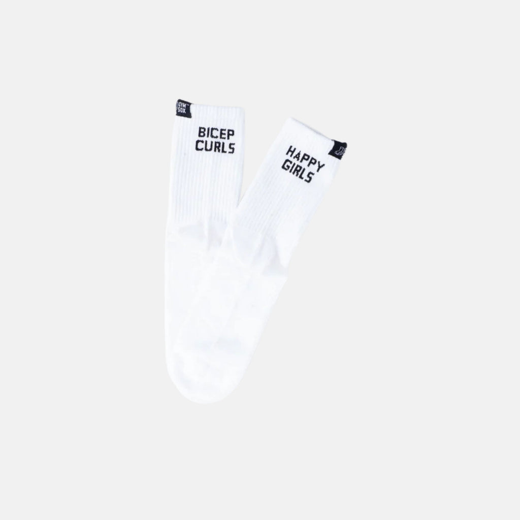 A pair of white crew socks with black text, one reading 'BICEP CURLS' and the other 'HAPPY GIRLS', shown against a light gray background.