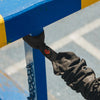 Black band holding onto a blue and yellow structure
