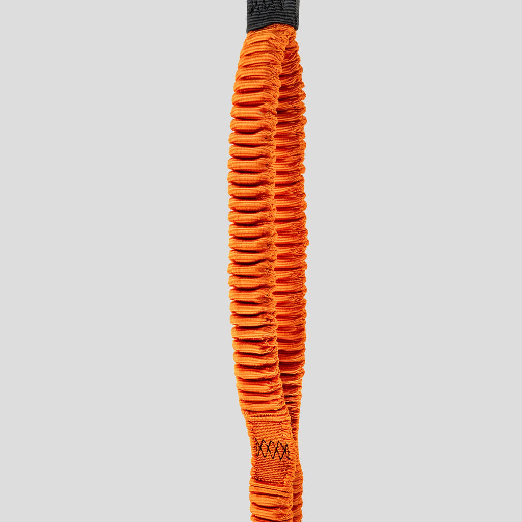 Orange resistance band detail on a gray background
