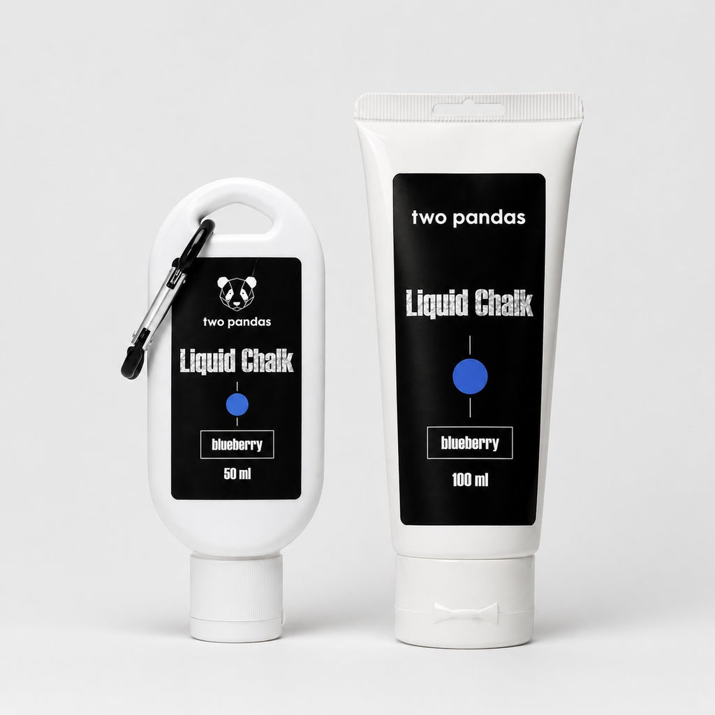 Two bottles of 'two pandas' liquid blueberry scented chalk with black labels on a white background