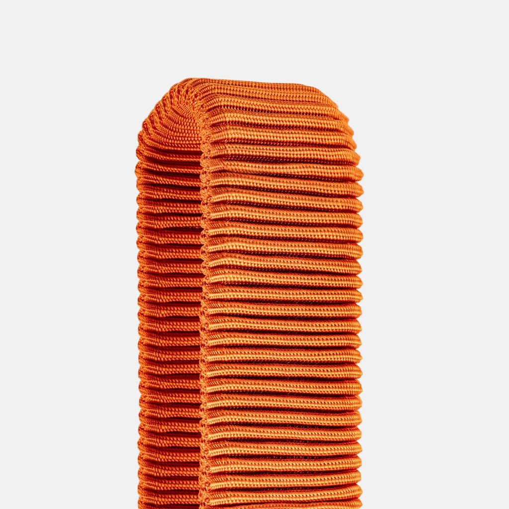 Orange fitness band on a light gray background
