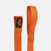 Orange strap with a black logo on a light gray background