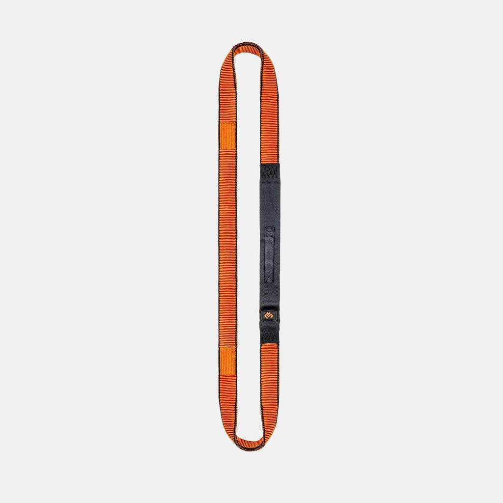 Orange and black resistance band on a light gray background