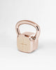 Alama Studio kettlebell striped white with rose gold metal on grey background