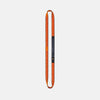 Orange and black resistance band on a light gray background