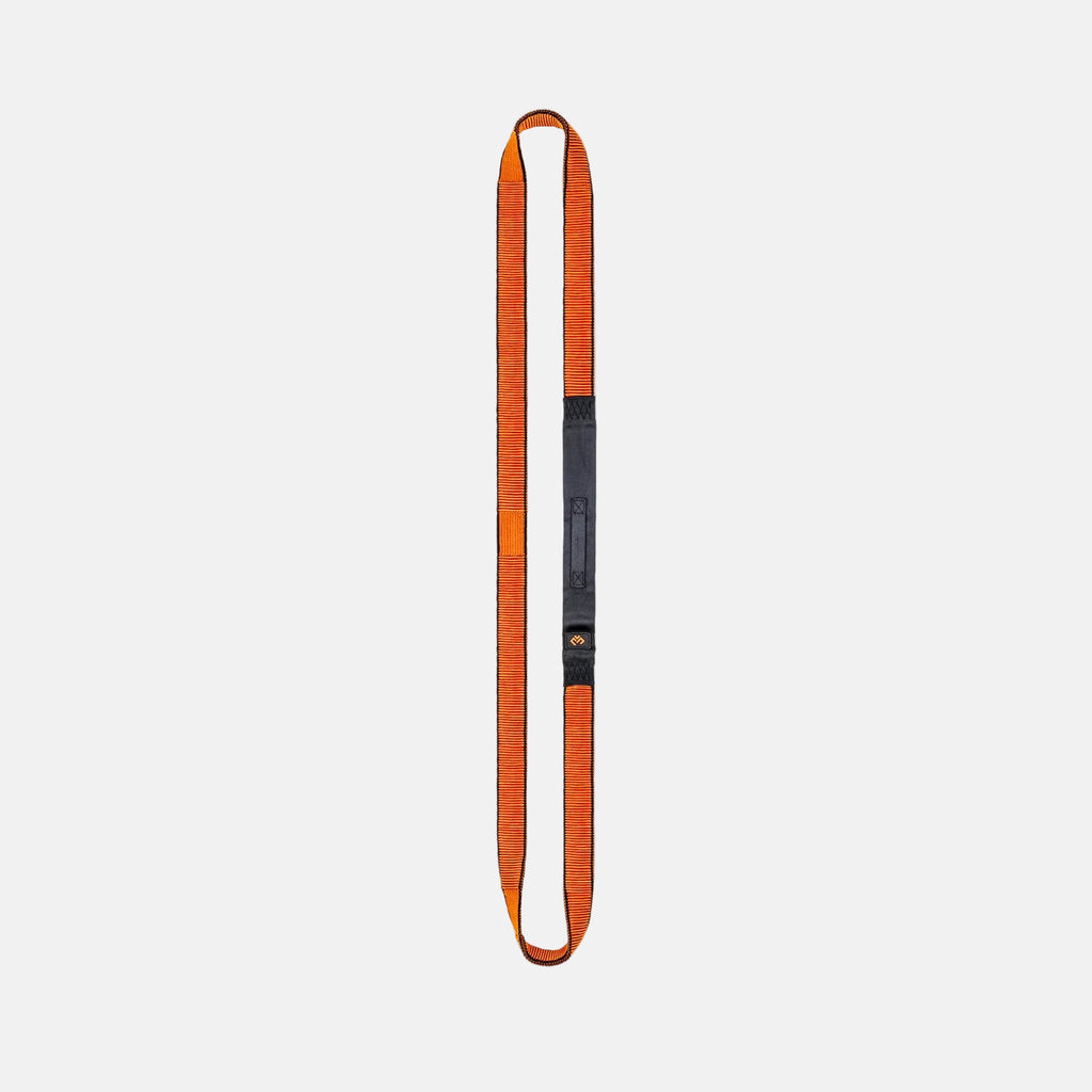 Orange and black resistance band on a light gray background