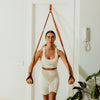 Woman using a resistance band in a home setting
