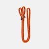 Orange resistance band on a light gray background