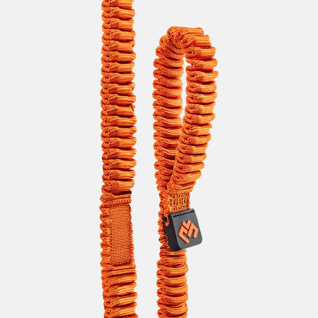 Orange resistance band on a light gray background