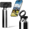 Silver water bottle with black cap, smartphone displaying a golf scene, and additional black cap on a white background.