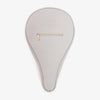 Gray padel bag with a gold zipper on a white background