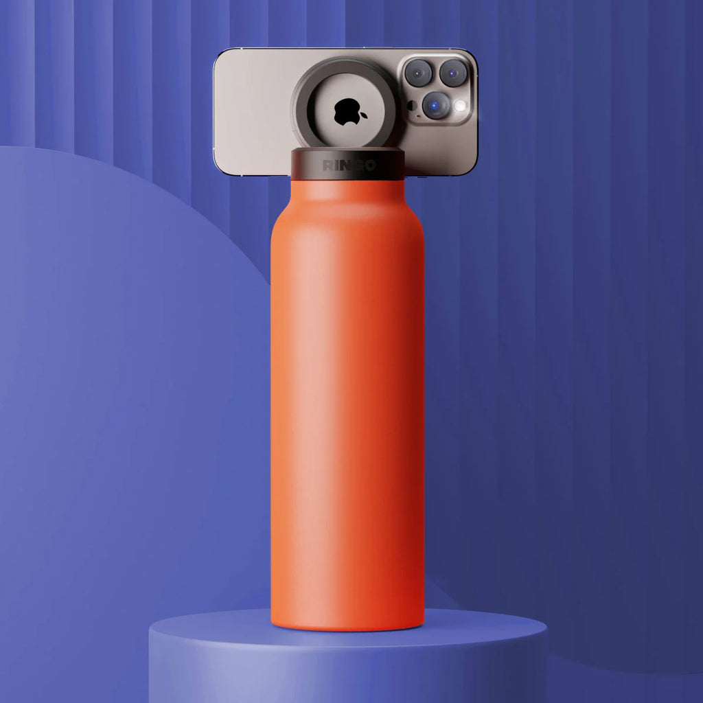 Orange water bottle with a smartphone on a blue background