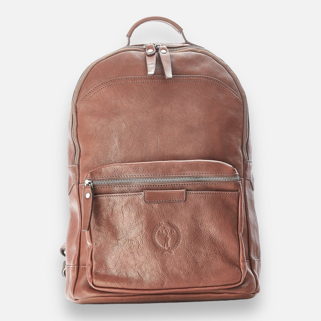 A brown leather backpack with a front pocket and visible zipper closure. The backpack features an embossed design on the front pocket.