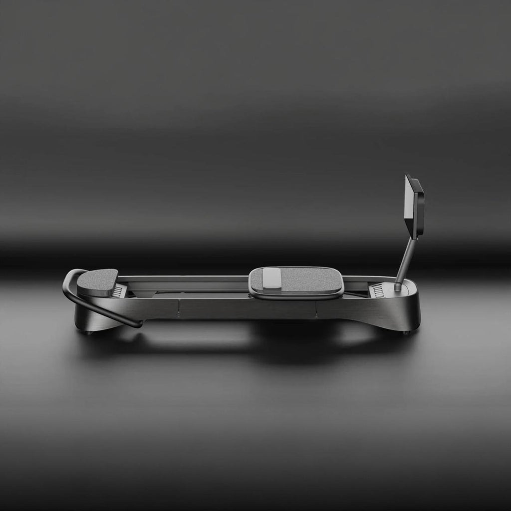 Black Frame connected reformer on a dark background