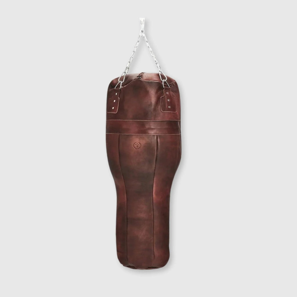 Brown leather punching bag on a light gray background