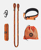 A set of orange resistance bands on grey background