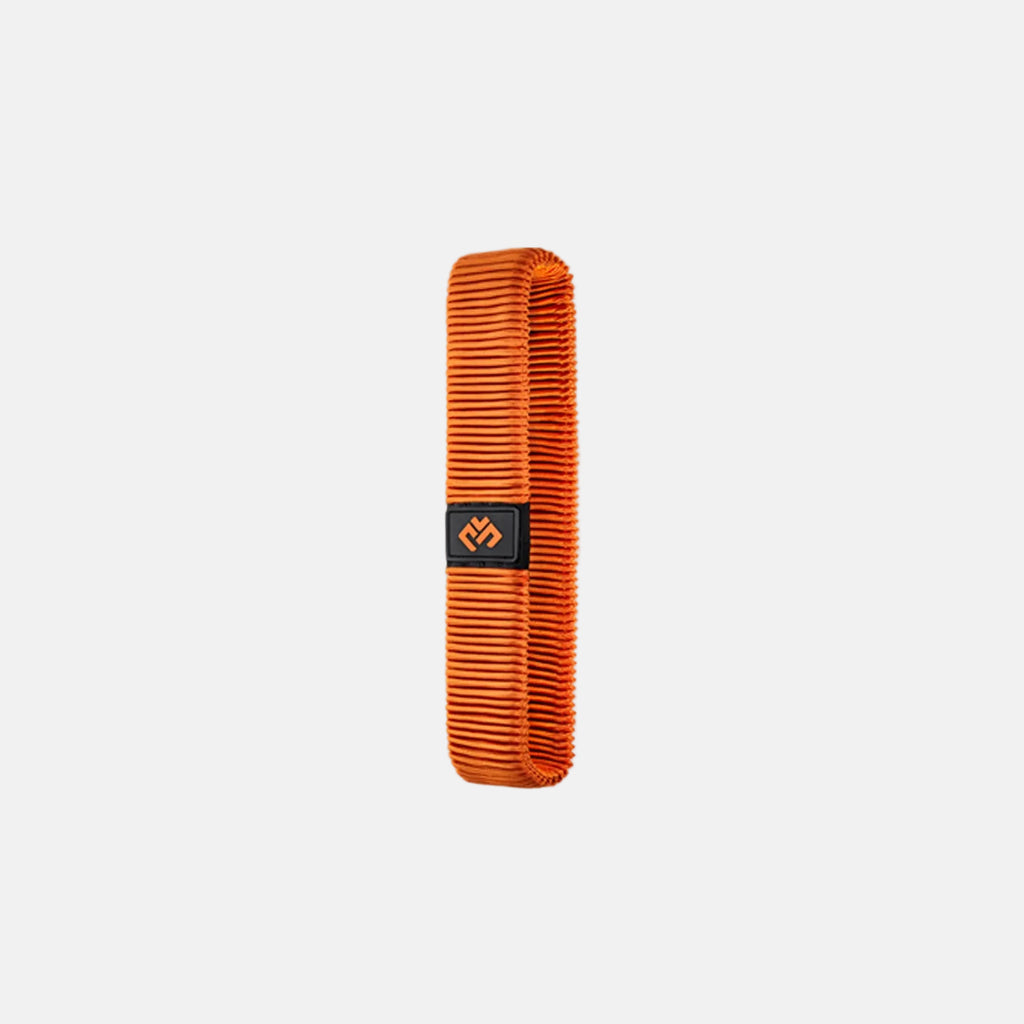 Orange fitness band on a light gray background