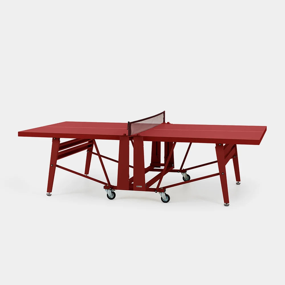 Red ping pong table on a white background
