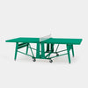 Green ping pong table with a white net on a white background