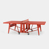 Red ping pong table on a white background
