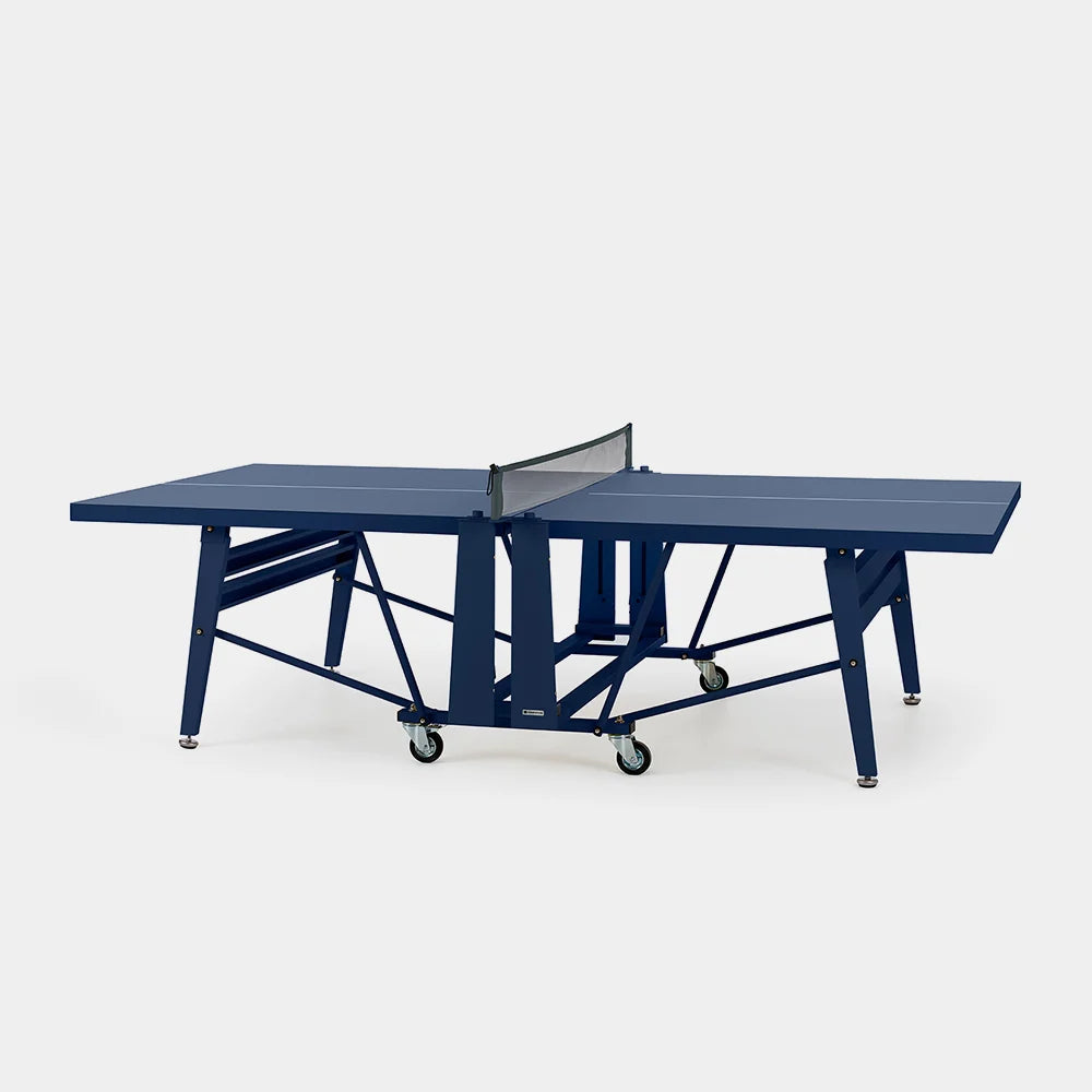 Blue folding ping pong table on grey background