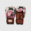 Pair of boxing gloves with floral design on a light gray background