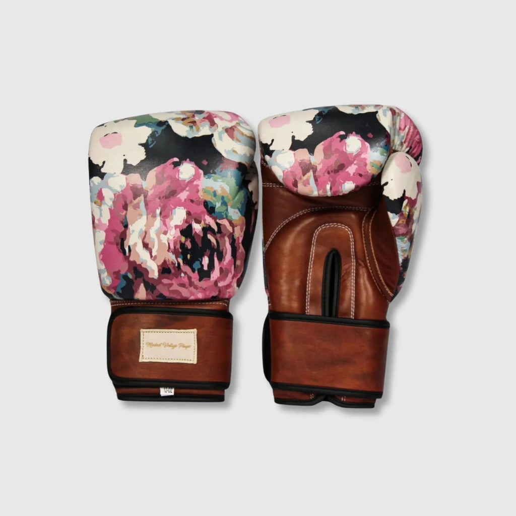 Pair of boxing gloves with floral design on a light gray background