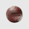 A brown, vintage-style T-panel soccer ball with embossed text and logo.