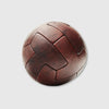 A brown, vintage-style T-panel soccer ball with embossed text and logo.