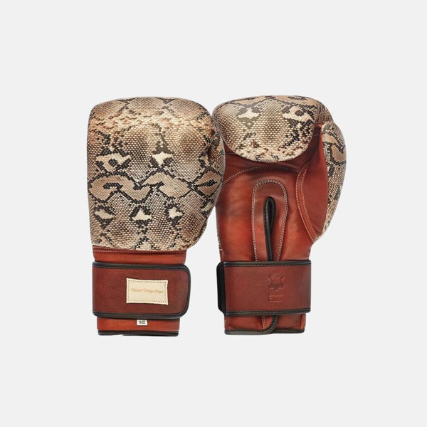 Modest Vintage Player snake skin boxing gloves with heritage brown leather on grey background.